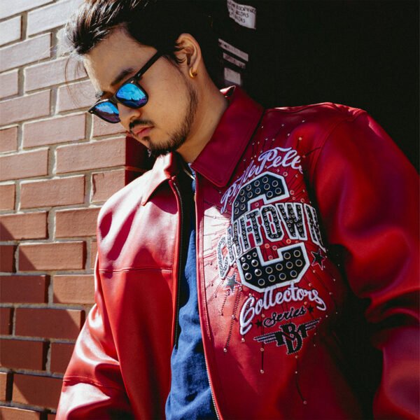 Stylish red Chi Town Pelle Pelle leather jacket with embroidered logo design, perfect for streetwear fashion.