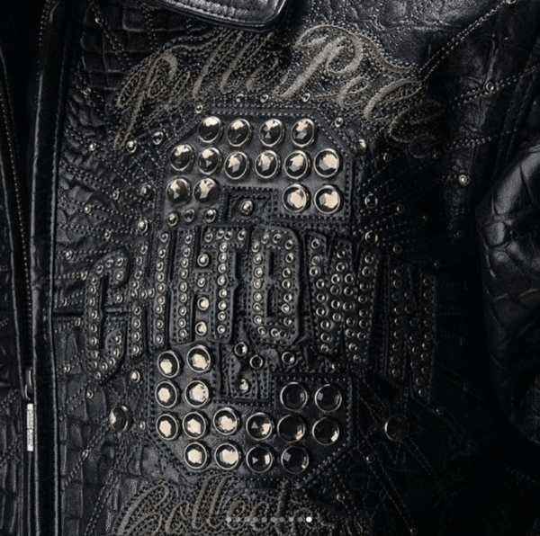 Close-up of black Pelle Pelle ChiTown Collector jacket chest with crocodile texture and studded C logo – Chi Town Pelle Pelle